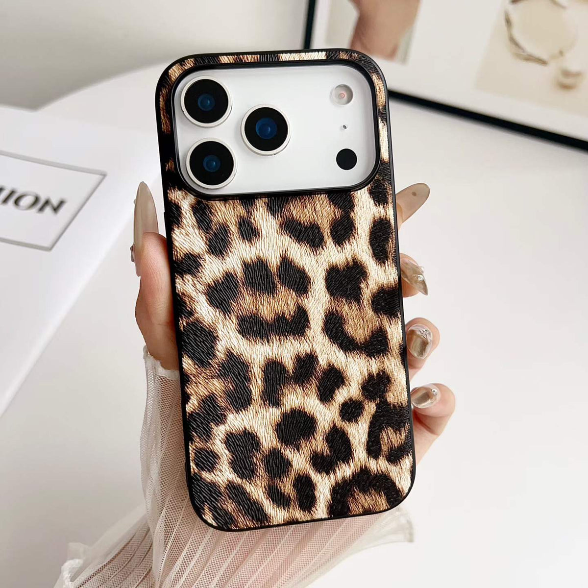 Leopard Print PU Phone Case - hand-held texture detail, iPhone shown