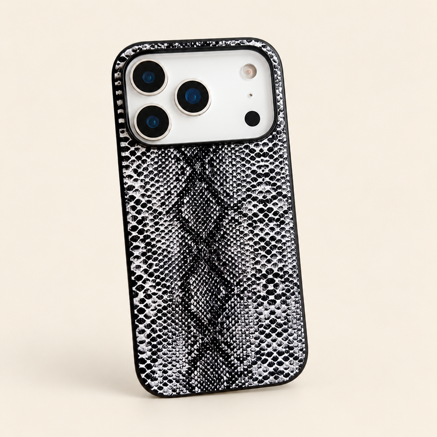Dark snakeskin-print PU phone case, clean rear view showing the black and white scale pattern and camera edge; iPhone version pictured