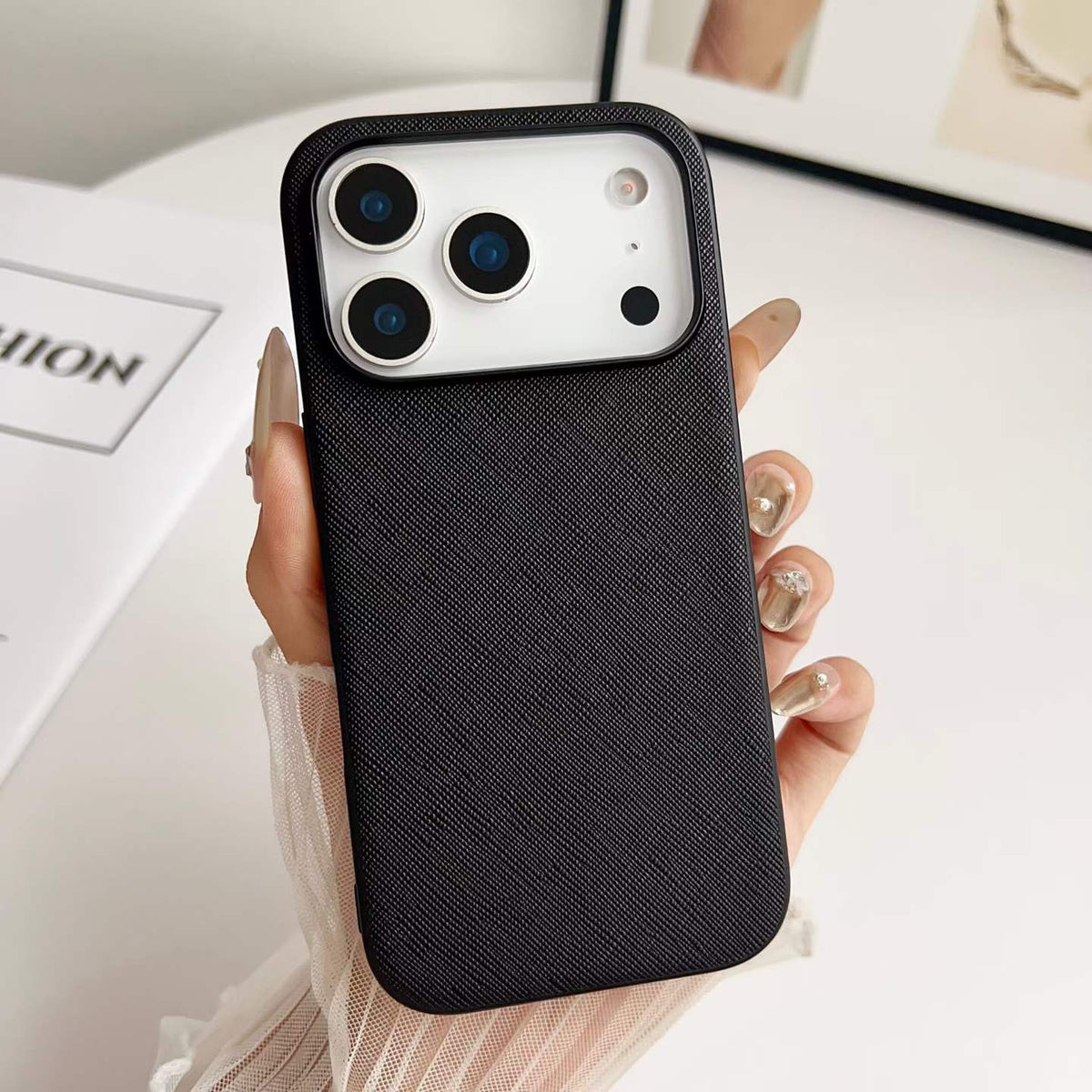 Black Woven-Texture PU Phone Case - hand-held texture detail, iPhone shown
